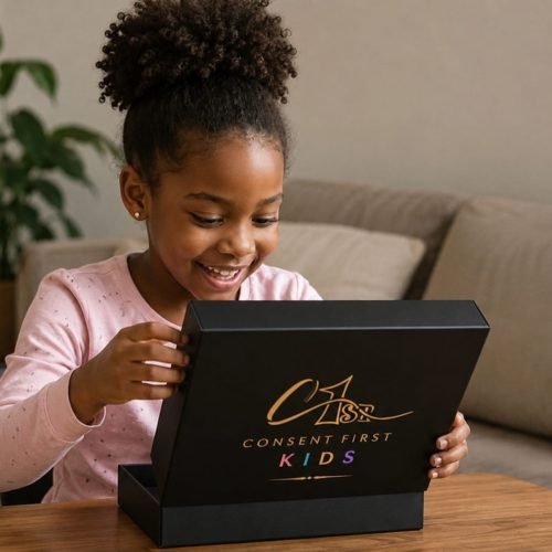 A smiling child opening a Consent First Kids Signature Box